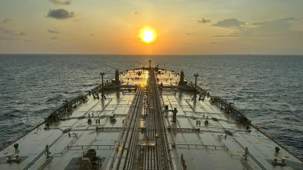 Oil tanker at sea during sunset