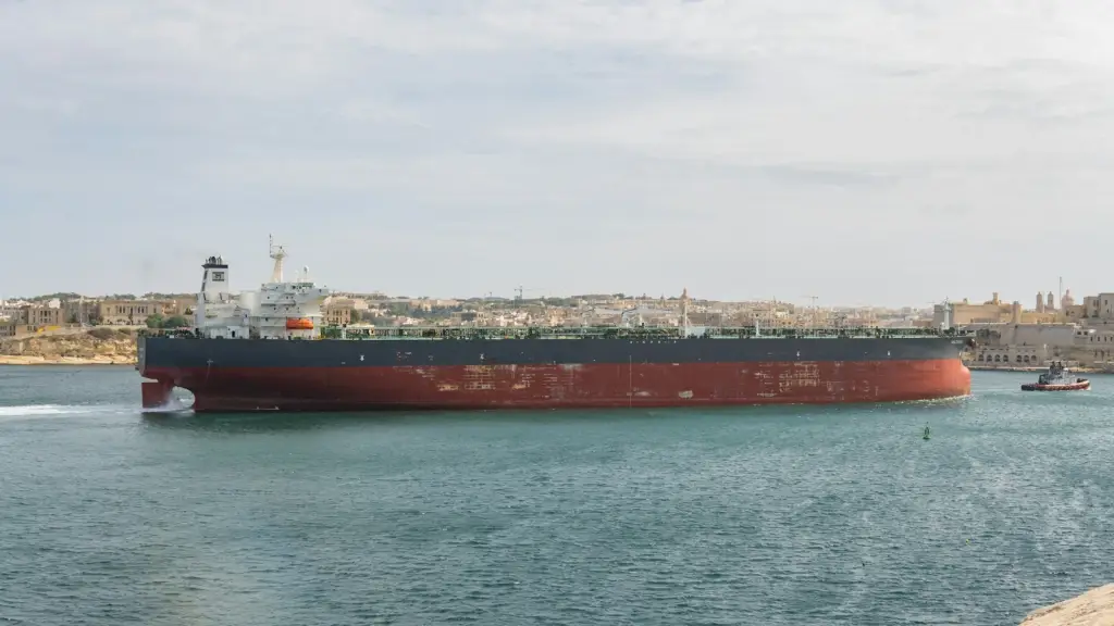 Large oil tanker ship moving through coastal waters