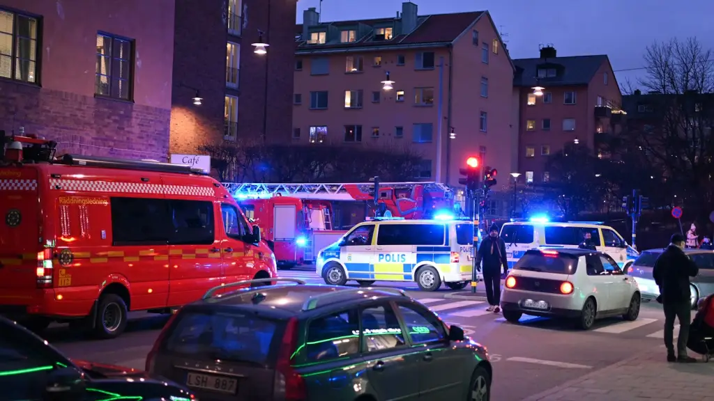 Emergency response vehicles on a city street at night