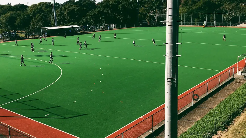 Green artificial hockey turf with red boundary line