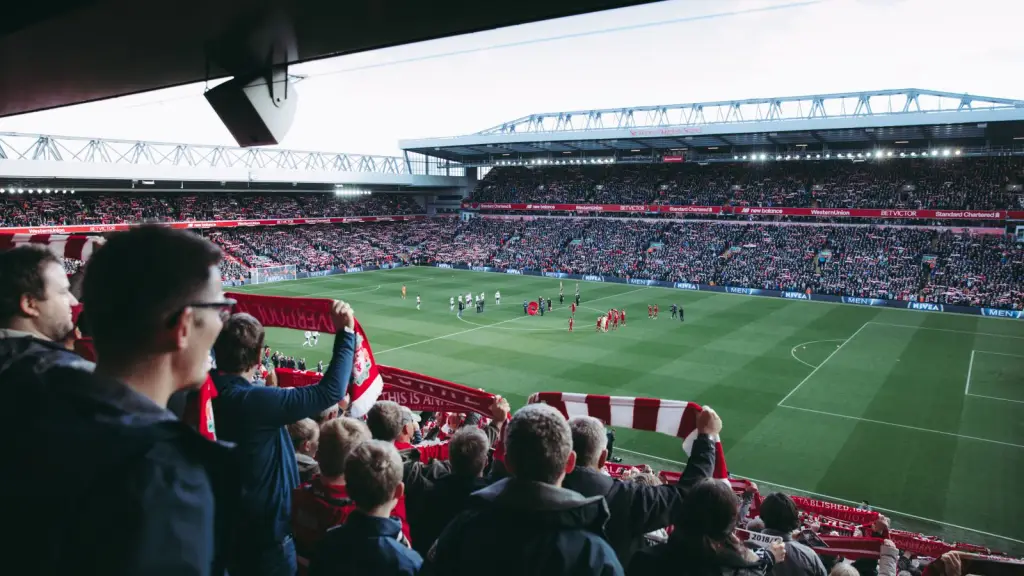 Spectators in a sports stadium watching a match