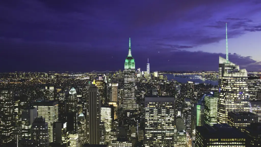 Night city skyline with illuminated high-rise buildings