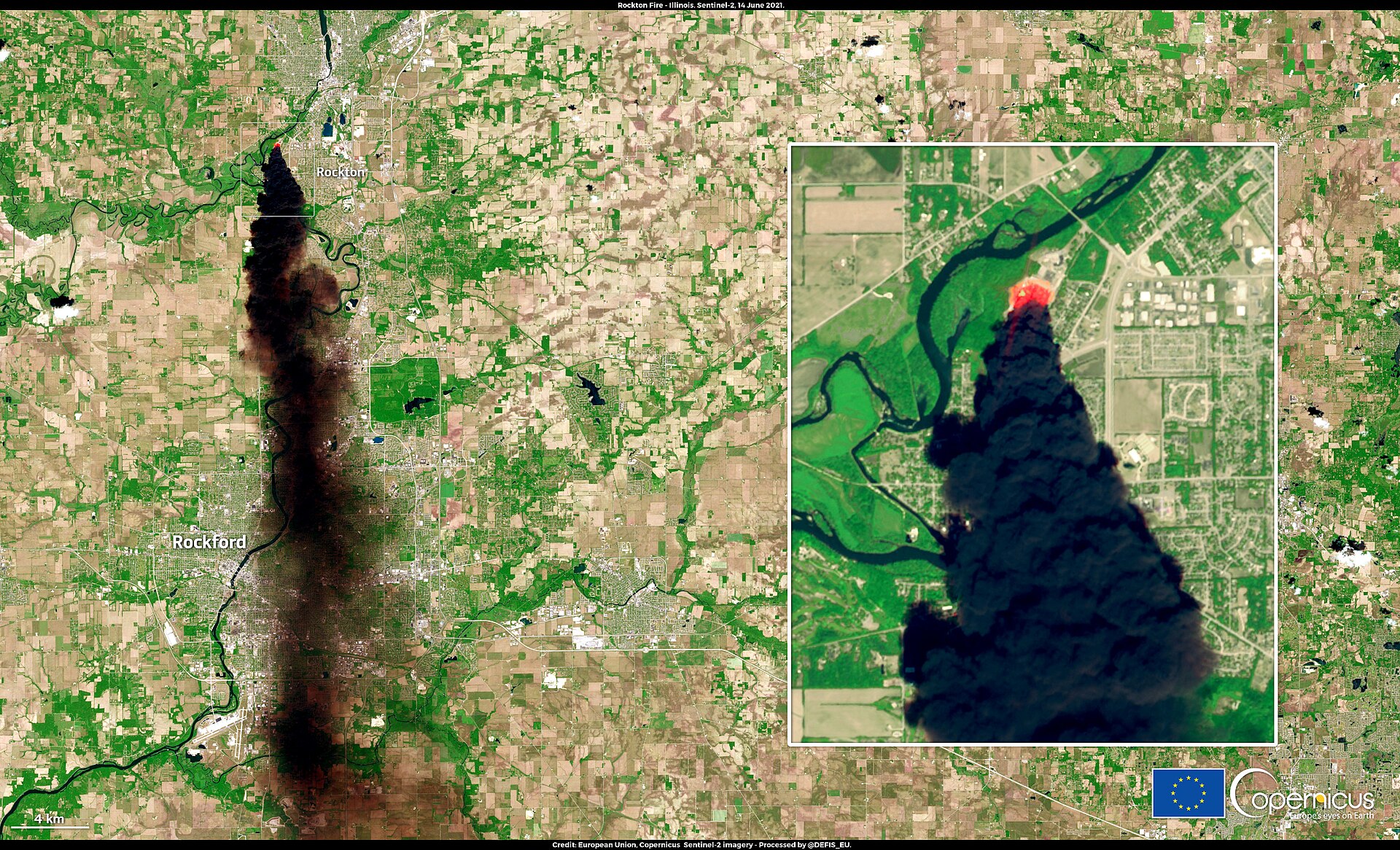 Black smoke plume from an industrial plant fire