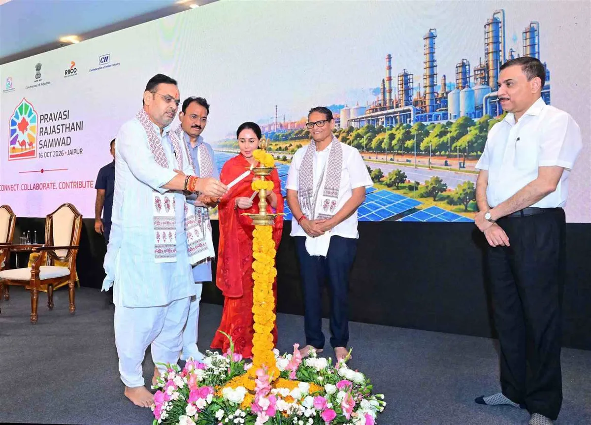The chief minister lights the lamp at the start of the programme