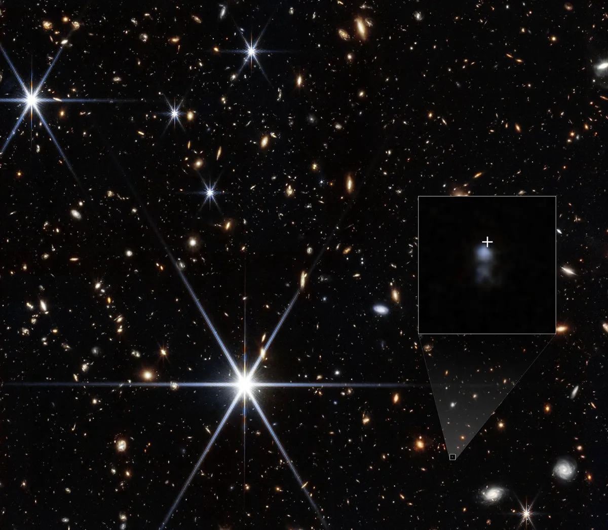 farthest fast radio burst: Webb's NIRCam view of the host galaxy, with the burst position marked by a white cross