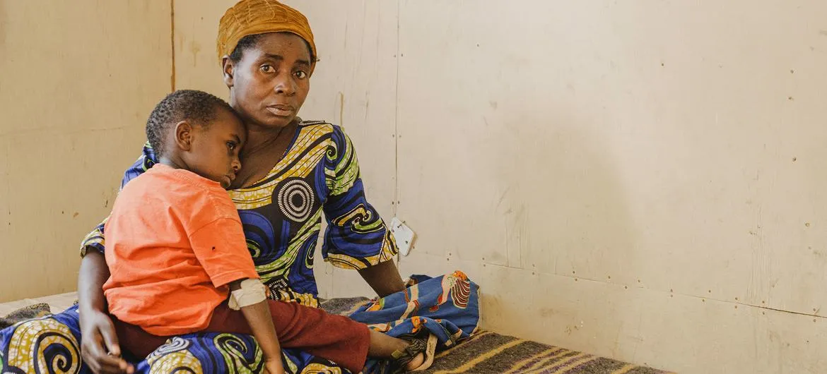 DR Congo cholera: A woman and child wait at a cholera treatment centre in South Kivu (file photo)