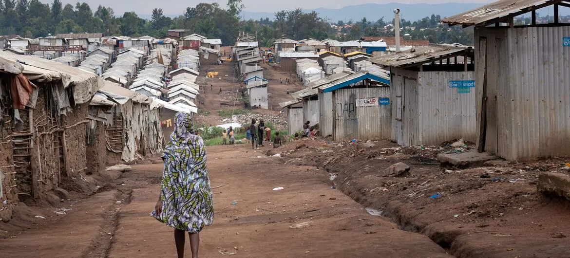 Multidimensional Poverty Index 2026: File photo: a woman walks through a camp for displaced people in Ituri, DR Congo
