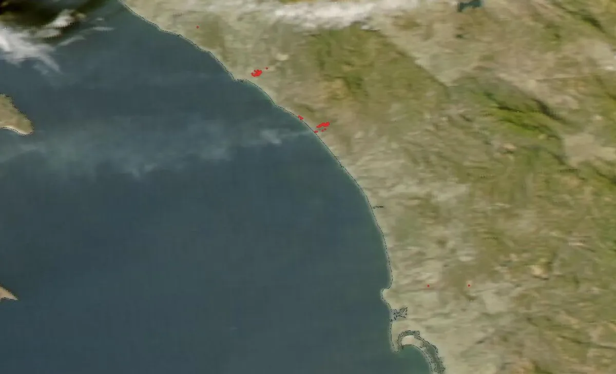 Henderson Fire: Smoke drifting off the Southern California coast near Camp Pendleton on 16 October 2026, with red dots marking satellite fire detections