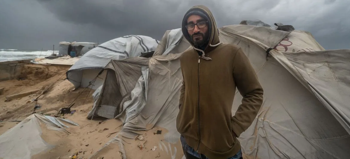 Gaza winter: A family shelter at Khan Younis port during an earlier winter storm (file photo)