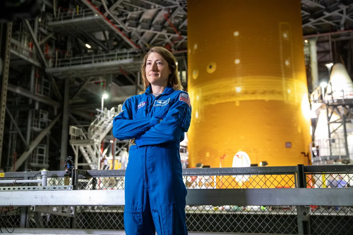Christina Koch: Koch in her flight suit at a NASA rocket facility