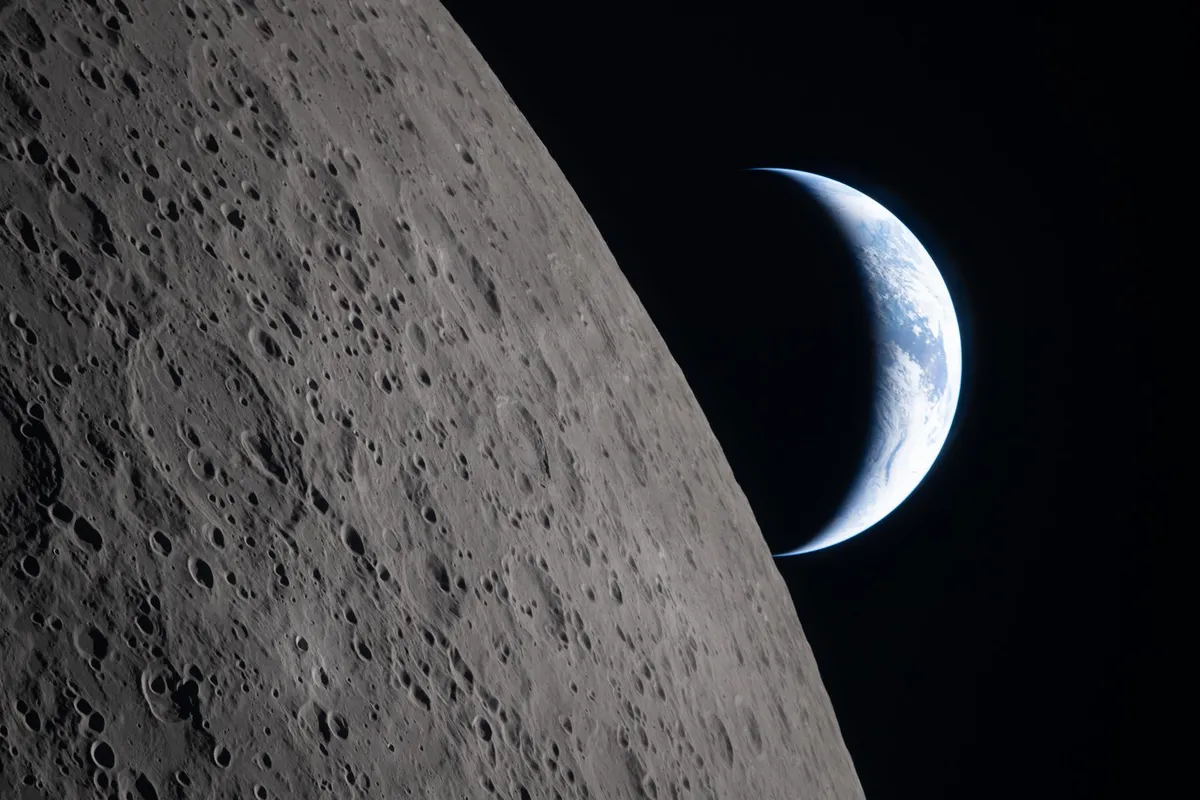 Artemis III: A crescent Earth sets on the Moon's limb, seen by the Artemis II crew on 6 April 2026