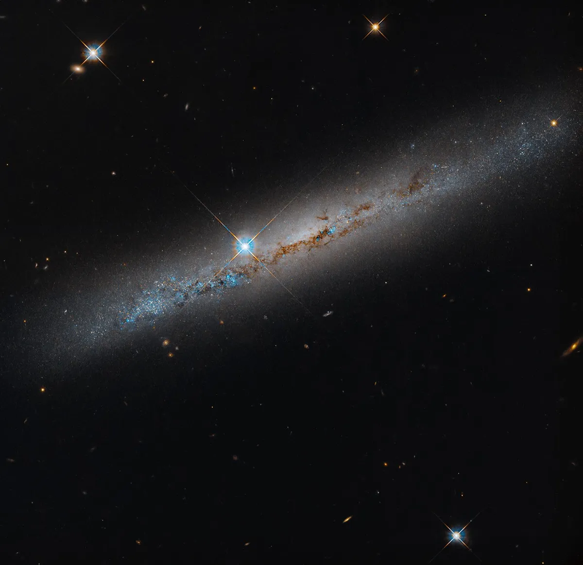 NGC 1827: Edge-on view of the galaxy's dusty disc taken by Hubble's Advanced Camera for Surveys